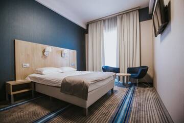 Фото номера Улучшенный двухместный номер с 1 кроватью Отель Hotel Radocza Park Business г. Radocza 3